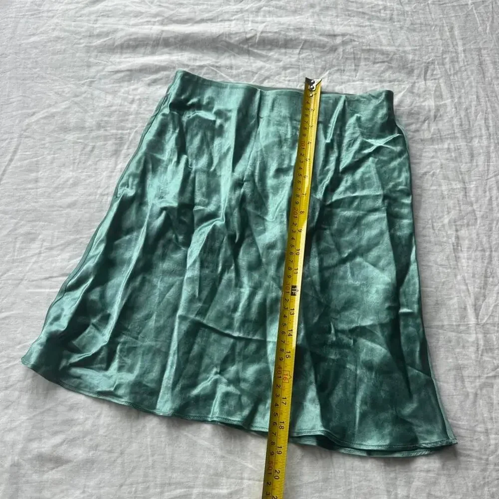 Green satin mini skirt in